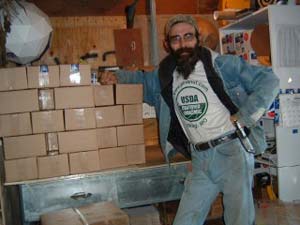 George Frazier, manager of Wild Crops Farm, wih packages ready to be shipped to customers.